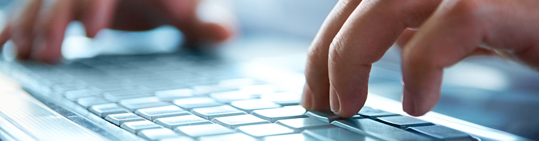 Laptop with someone pressing the keyboard