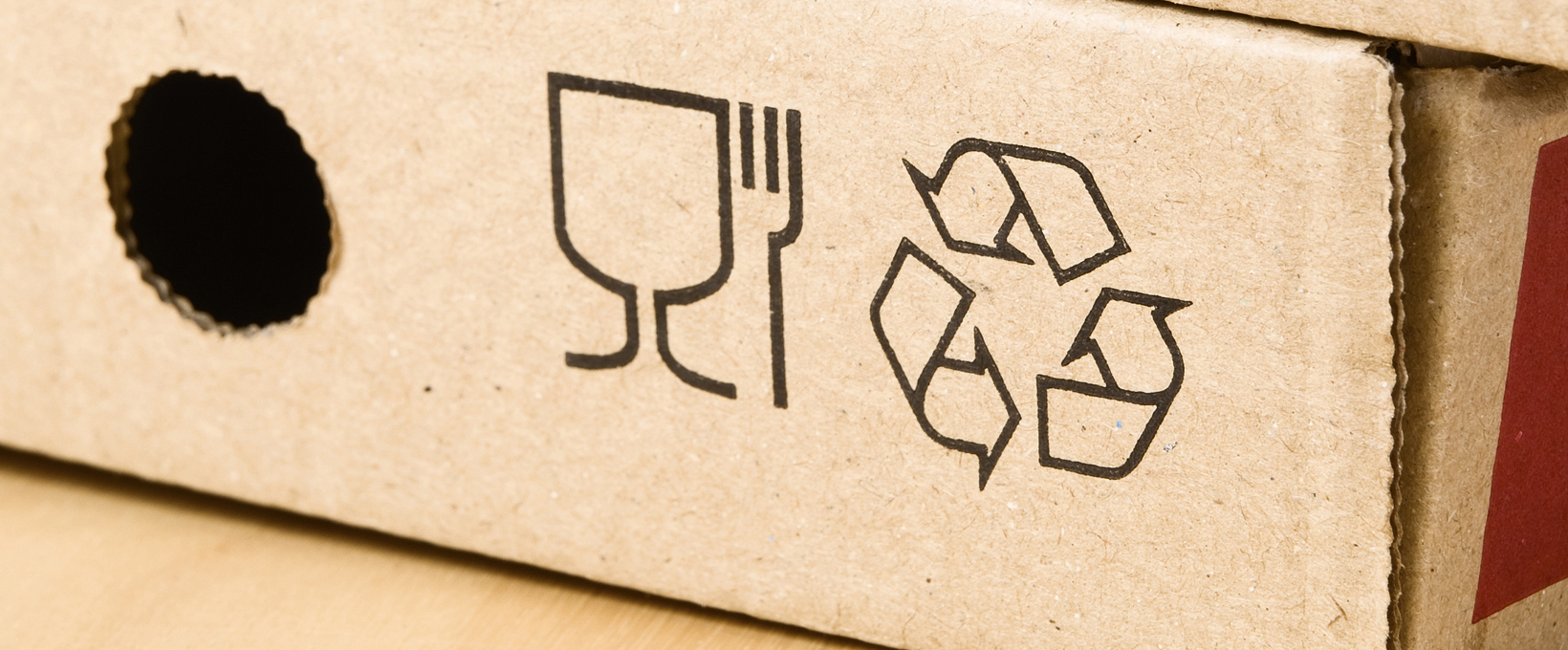 Packaging with recycle symbol in it