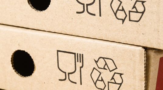 Packaging with recycle symbol in it