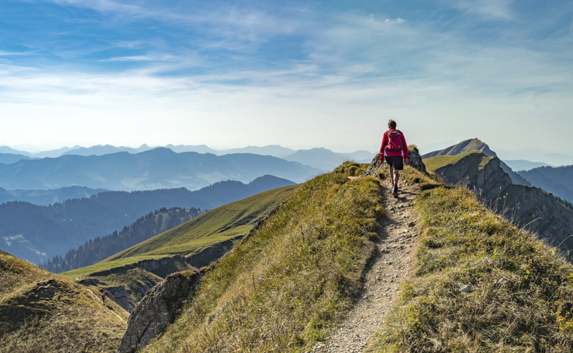 Person walking along the top of a mountain. Amazing views